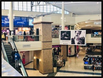 Large hanging advertising banner in a mall center court